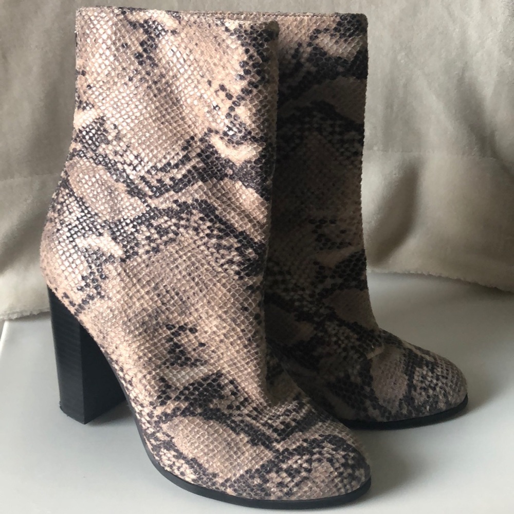 A+ tall snakeskin heeled booties